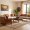 Living room in Pune with Soulwood Ventures’ solid wood sofa, Indian sittings, and center table.